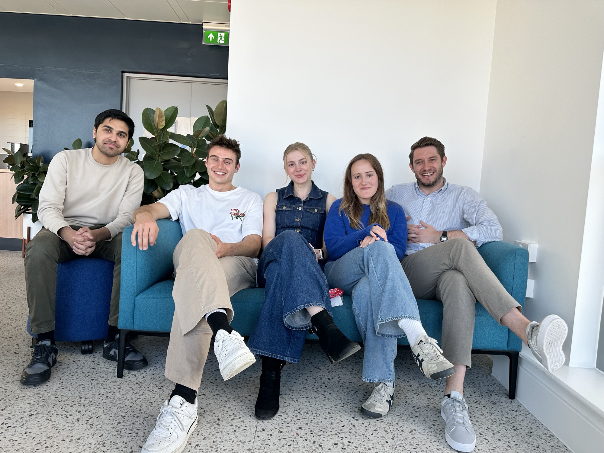 Members of the VIBES Lab sitting together on a sofa